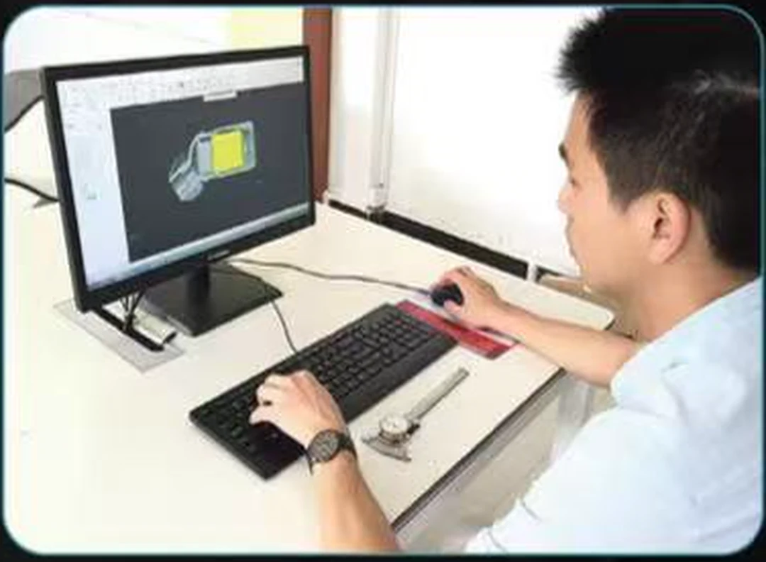 JRT engineer reviewing headphone product structure