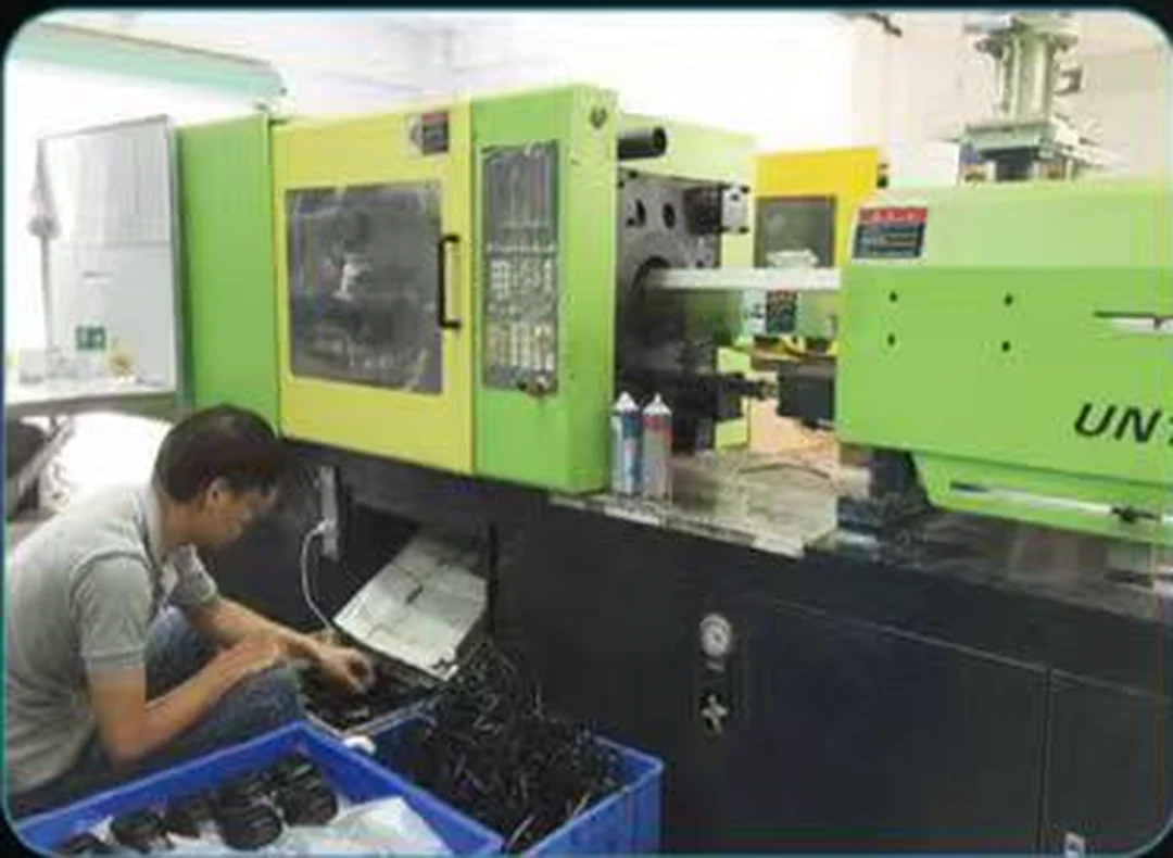 Injection molding equipment supporting headphone components